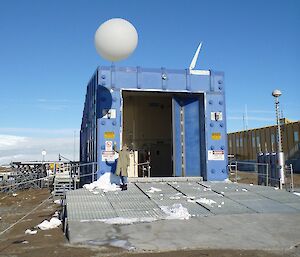 Kelvin, Mawson Met Tech releasing his first balloon outside the blue Met Balloon Release Building