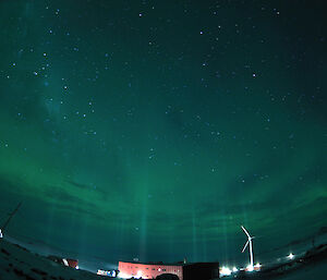 Vertical pillars light reach skyward, the result of diamond dust