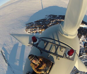 A view of Mawson rock, sea ice and ice cliffs from the top of the wind turbine