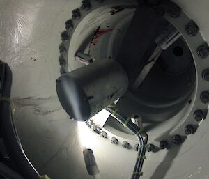 Looking down inside a rotor blade showing three grease canisters