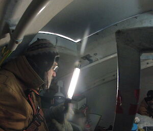 Two expeditioners working in the top of the wind turbine