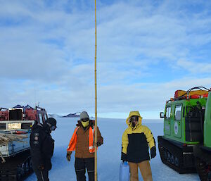 The red Hagg on the left and the green Hagg on the right on a Caning Maintenance trip with 3 expeditioners at the cane with Mt Henderson in the background