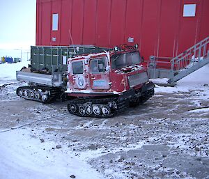 The red Hagg being used for the garbage run with the tray loaded with black garbage bags full of rubbish