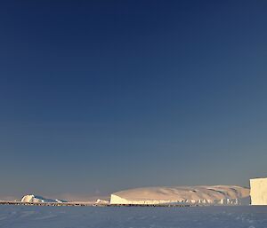 The auster emperor penguin colony last week with the massive icebergs and the plateau in the distance