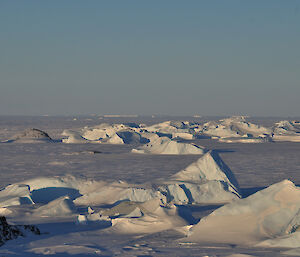 A large number of icebergs within the frozen sea-ice