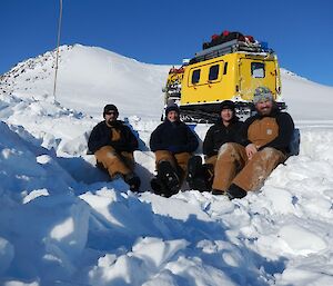 The yellow hagglunds and the four expeditioners who travelled in it