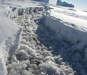 A wide break in the sea-ice produced by tidal changes and currents