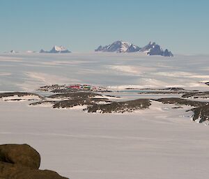 Mawson Station from the peak of Welch Island with the David range and the twin peaks of Mt Hordern in the background