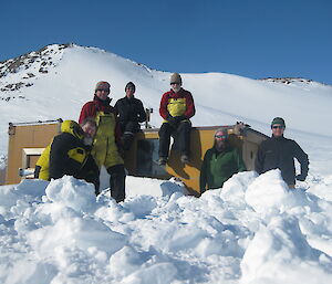 Six expeditioners at Colbeck hut partly buried in snow
