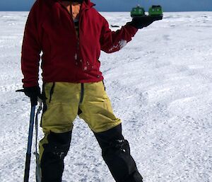 An expeditoner appearing as if he is holding the Hägglunds in his hand