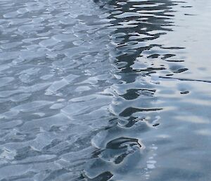 The top surface of a frozen lake polished by the wind