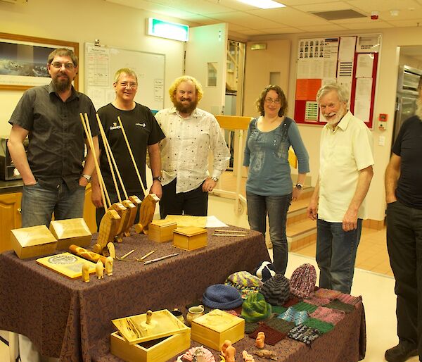 A display of craft work surrounded by 6 expeditioners