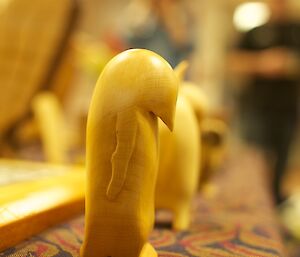 A scupture of an emperor penguin made from Huon pine by an expeditioner