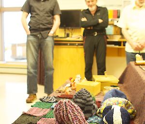 The textile section of craft work with three expeditioners in the background