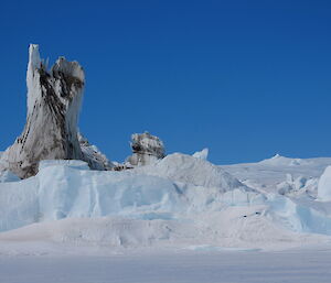 An iceberg containing soil and rocks from Moraine collected when carved from the plateau