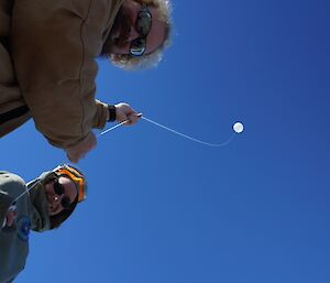 Two expeditioners and a balloon