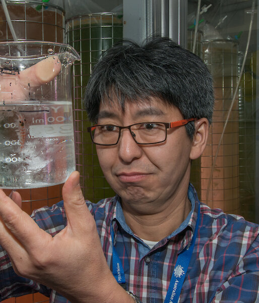 Krill biologist Dr So Kawaguchi with a beaker of krill