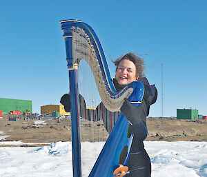 Alice Giles adds some glamour to Mawson station with her electro-acoustic harp on the sea ice.