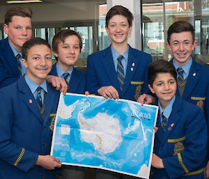 Students with a map of Antarctica