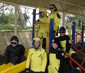 School students trying on Antarctic clothing