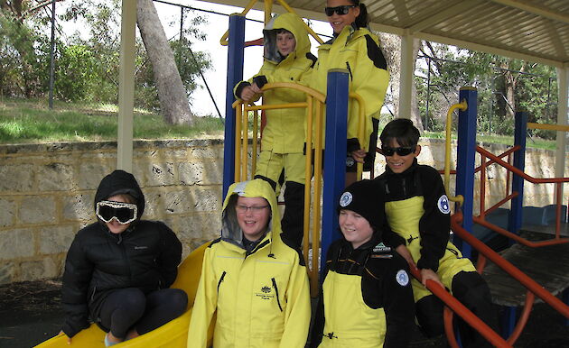 School students trying on Antarctic clothing