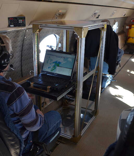 Scientists on board the Gulfstream V aircraft studying real-time data collected by the aircraft’s cloud radar.