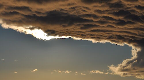 Clouds over calm waters near Davis research station.