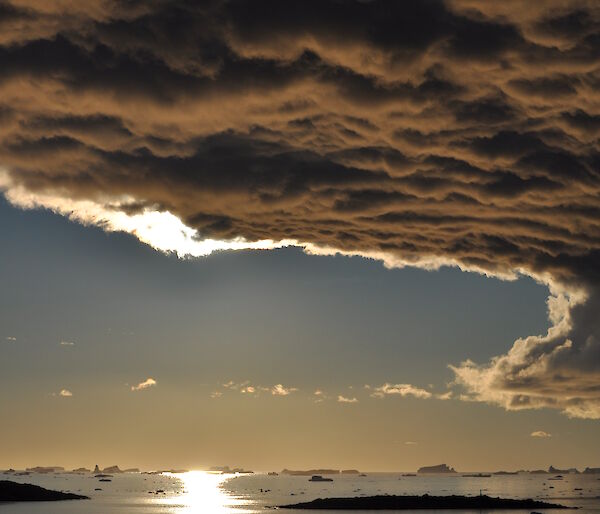 Clouds over calm waters near Davis research station.