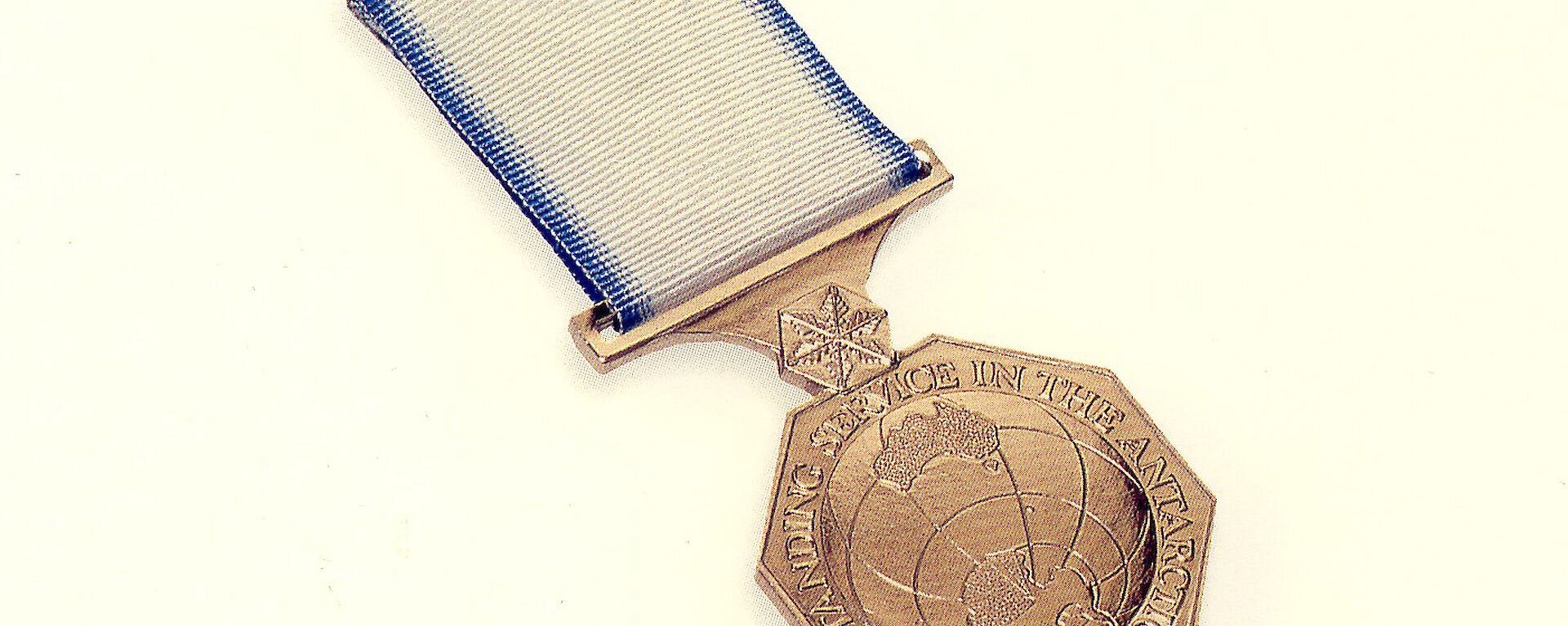 This bronze medal shows a map of Antarctica and the words ‘For outstanding service in the Antarctic'