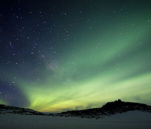 Dark sky with swirling green lights.