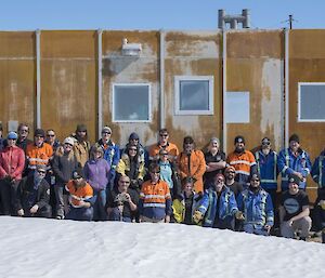 Group shot in front of yellow shed