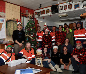 group photo with a Christmas tree.