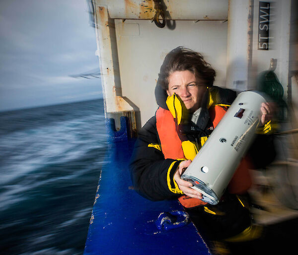 Susie Calderan deploys a sonobuoy off the deck of the New Zealand ship Tangaroa.