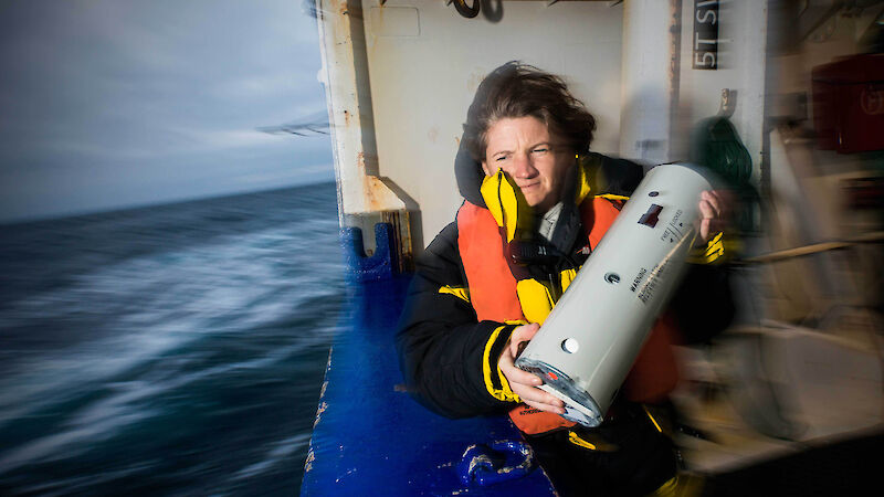 Susie Calderan deploys a sonobuoy off the deck of the New Zealand ship Tangaroa.