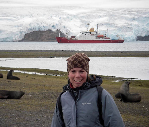 Jan Strugnell at Carlini base with the ship James Clark Ross in the background.