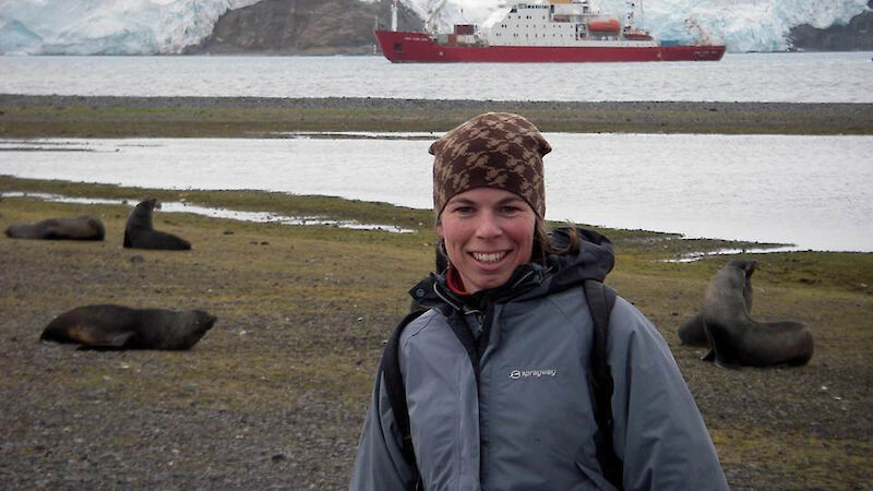 Jan Strugnell at Carlini base with the ship James Clark Ross in the background.