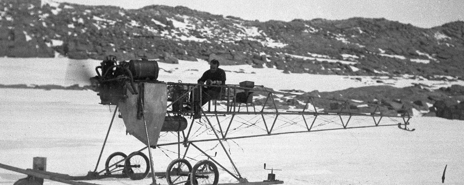 Francis Bickerton on the air tractor during the Australasian Antarctic Expedition.