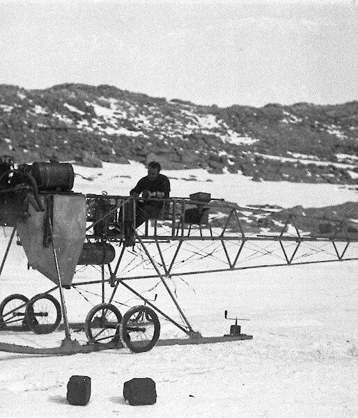 Francis Bickerton on the air tractor during the Australasian Antarctic Expedition.
