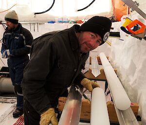 Glaciologist examines an ice core
