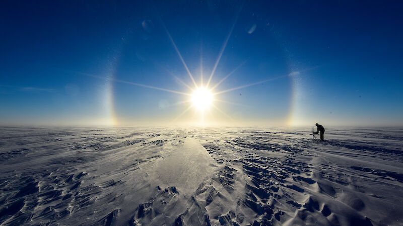 Scientists at work in the glow of a solar halo at Law Dome.