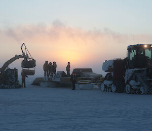 Loading cargo on to sled, ready to transfer to station.