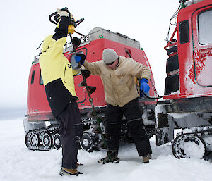 Kym Newbery using an ice drill in Antarctica