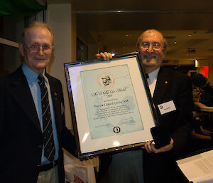 Professor Pat Quilty receives his award from ANARE club President