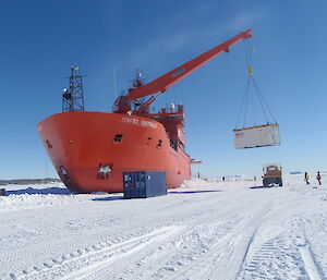 The Aurora Australis unloading cargo on the sea ice at Davis.