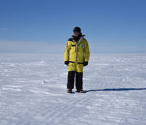 The Governor General standing alone on the ice in Antarctica.