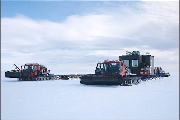 Tractors hauling equipment and supplies in a traverse convoy