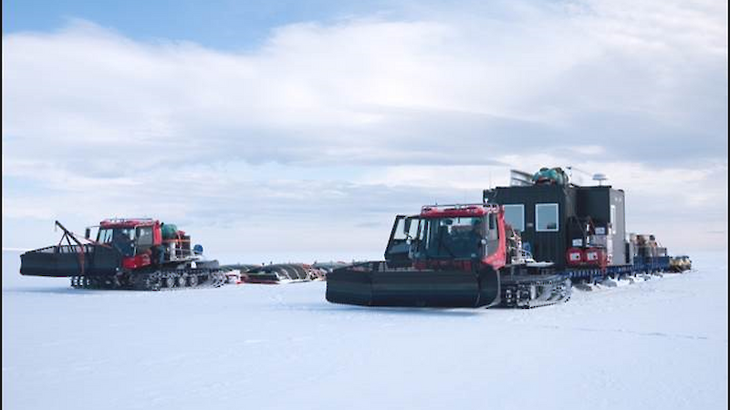 Tractors hauling equipment and supplies in a traverse convoy