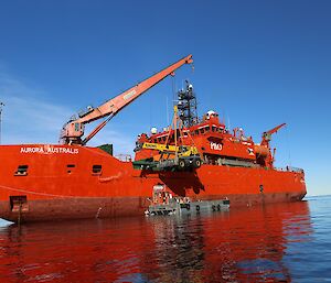 The Aurora Australis delivers a crane to Casey research station during the annual resupply.