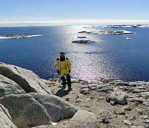 Environmental Analyst Bianca Mattos takes in the view from a rocky outcrop near Casey station.
