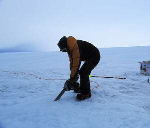 Scientists chainsawing samples of the Jökalhlaup